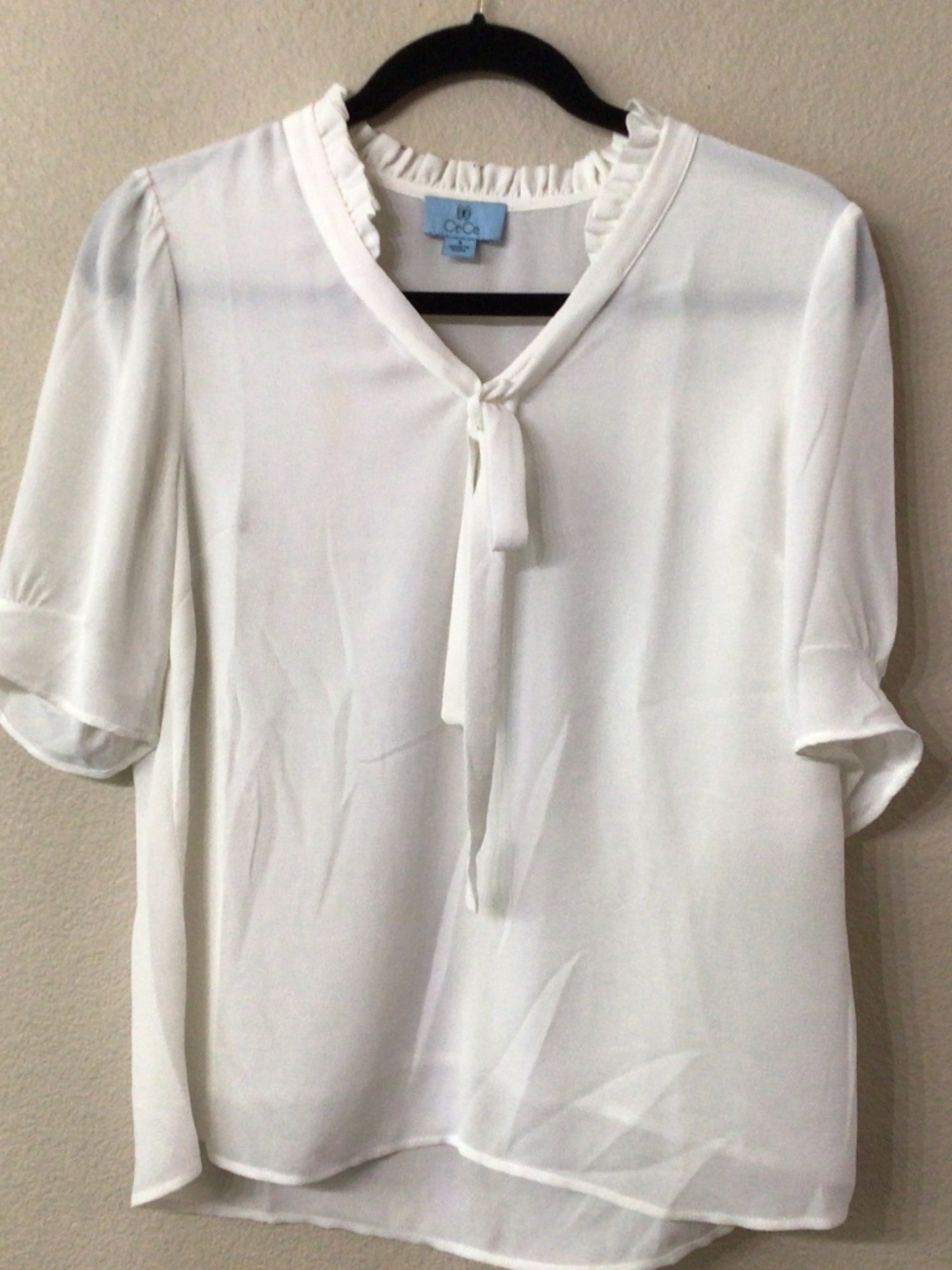 CeCe off white Blouse with tie around the V neck. Size S Great shape